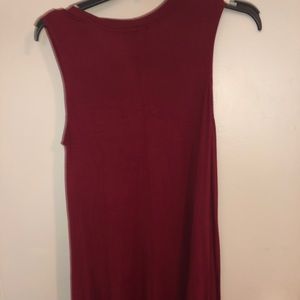 Sleeveless dress with necklace attached. Flowy